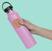 https://cdn.shopify.com/s/files/1/0756/6183/6582/files/SlabsCircleGrooveOrange_Bottle1.jpg?v=1767716609